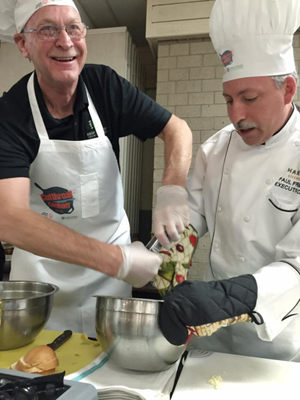 Wayne Chambers assists Chef Paul Freimuth