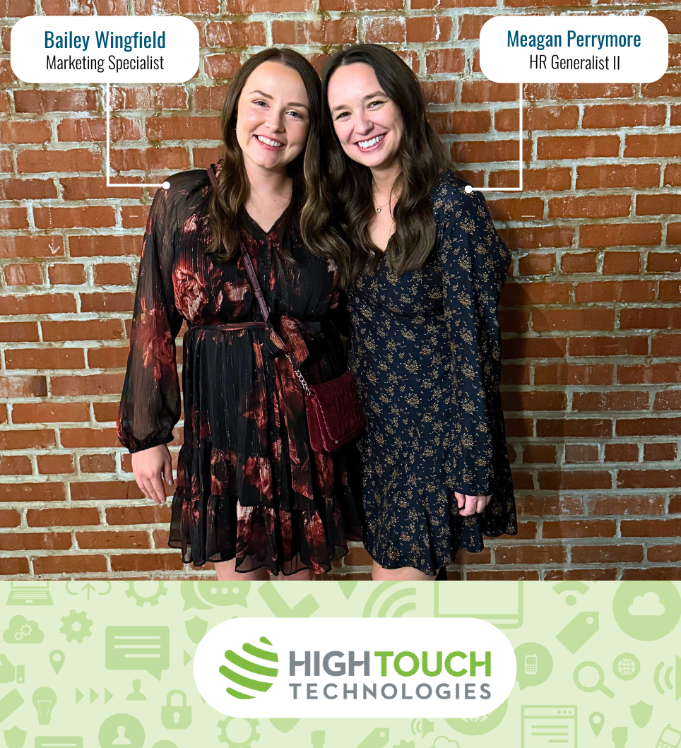 Bailey Wingfield, Marketing Specialist, and Meagan Perrymore, HR Generalist II, from High Touch Technologies smile together in front of a brick wall at the 2025 W Game Changers Gala.