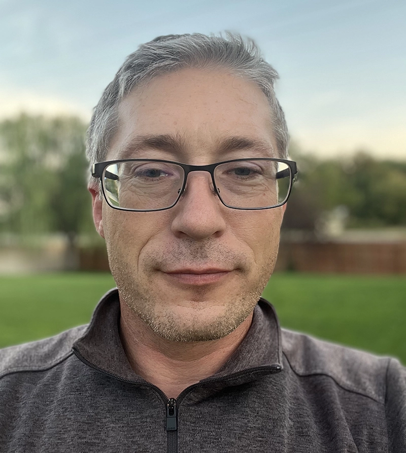 Photo of Desmond Pickard, Senior Systems Engineer at High Touch Technologies, standing outdoors.